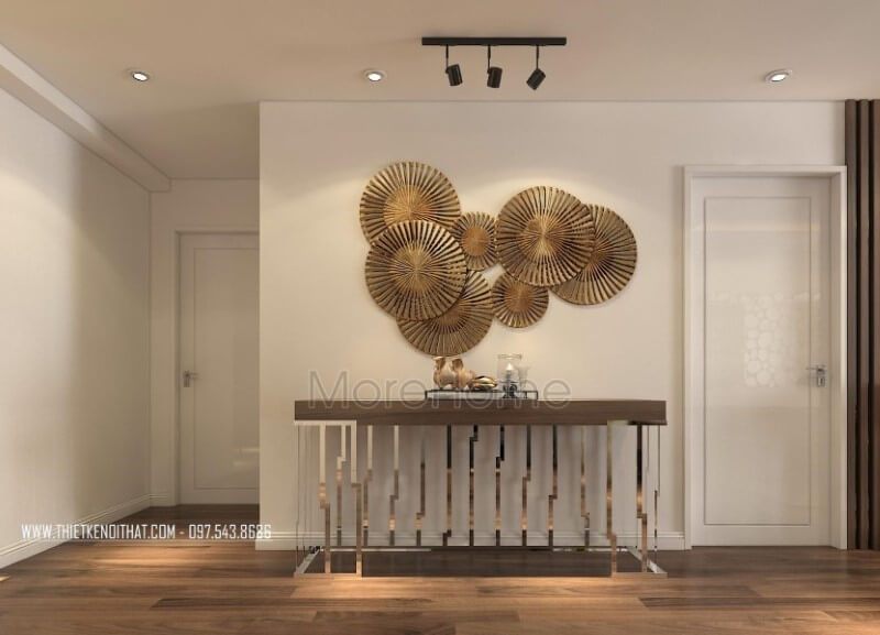Một mẫu kệ decor gỗ óc chó hiện đại cao cấp tinh tế chân inox mạ vàng được thiết kế để trang trí căn hộ chung cư Imperia Garden Hà Nội.